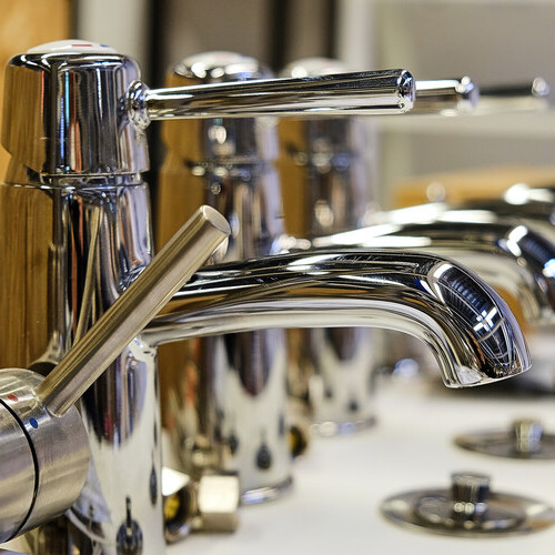 view of commercial plumbing faucets