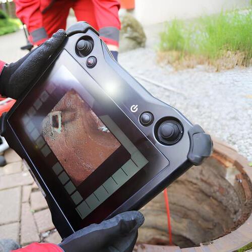 plumber conducting an inspection with a camera