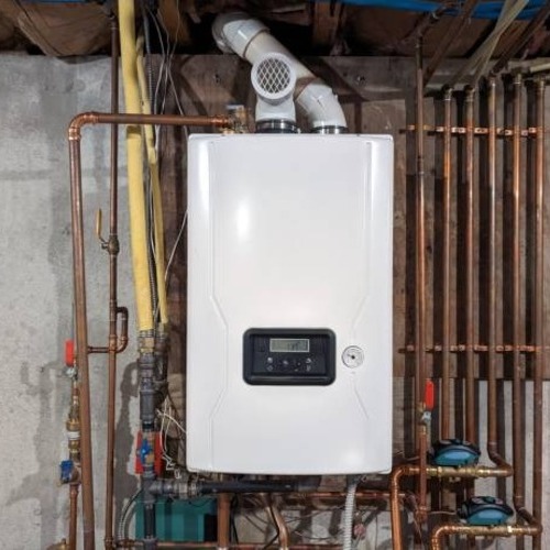 tankless water heater installed against a wall